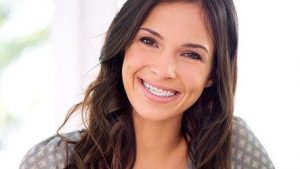 smiling woman with adult braces